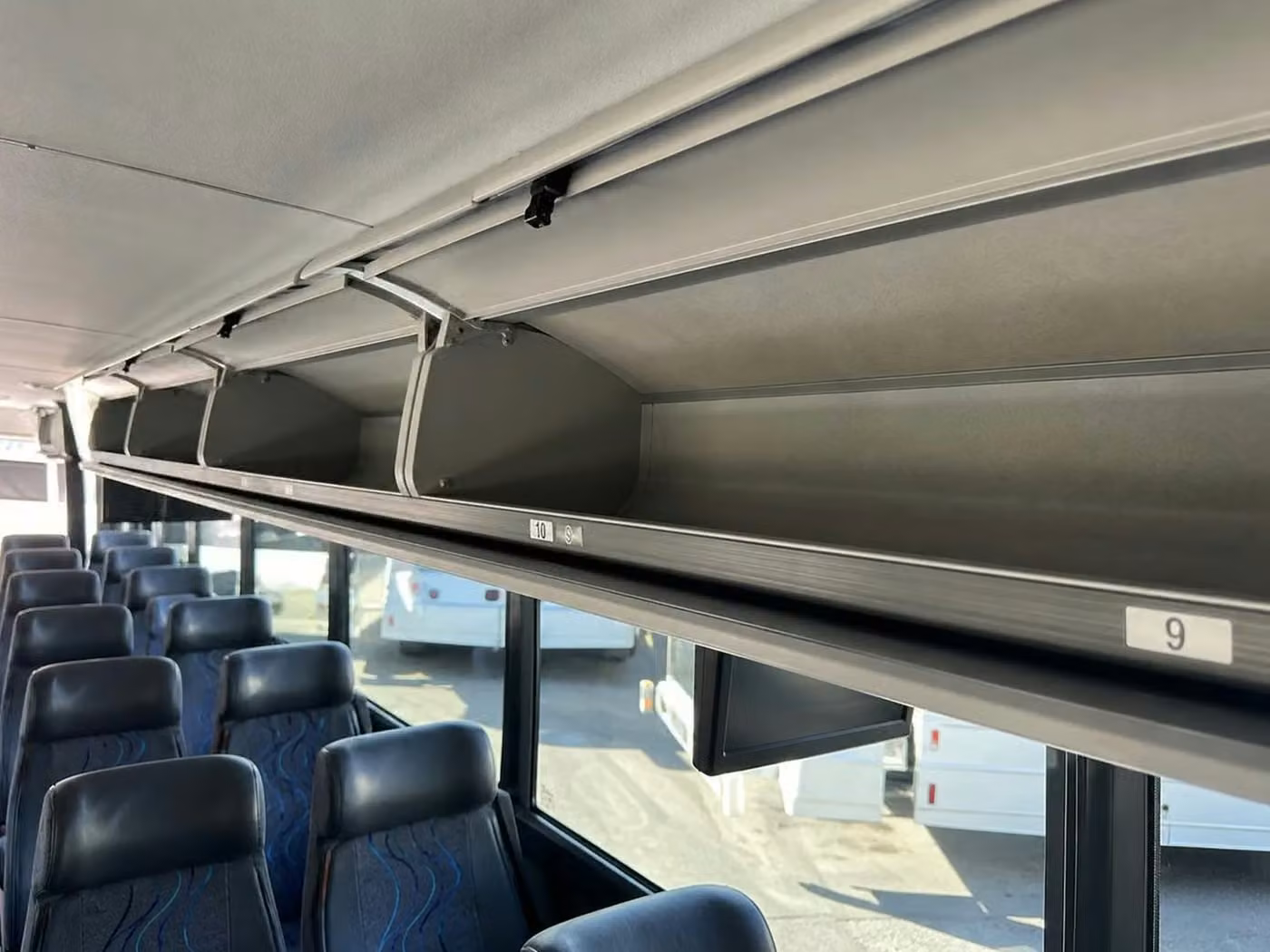 tucker 18 passenger minibus overhead storage