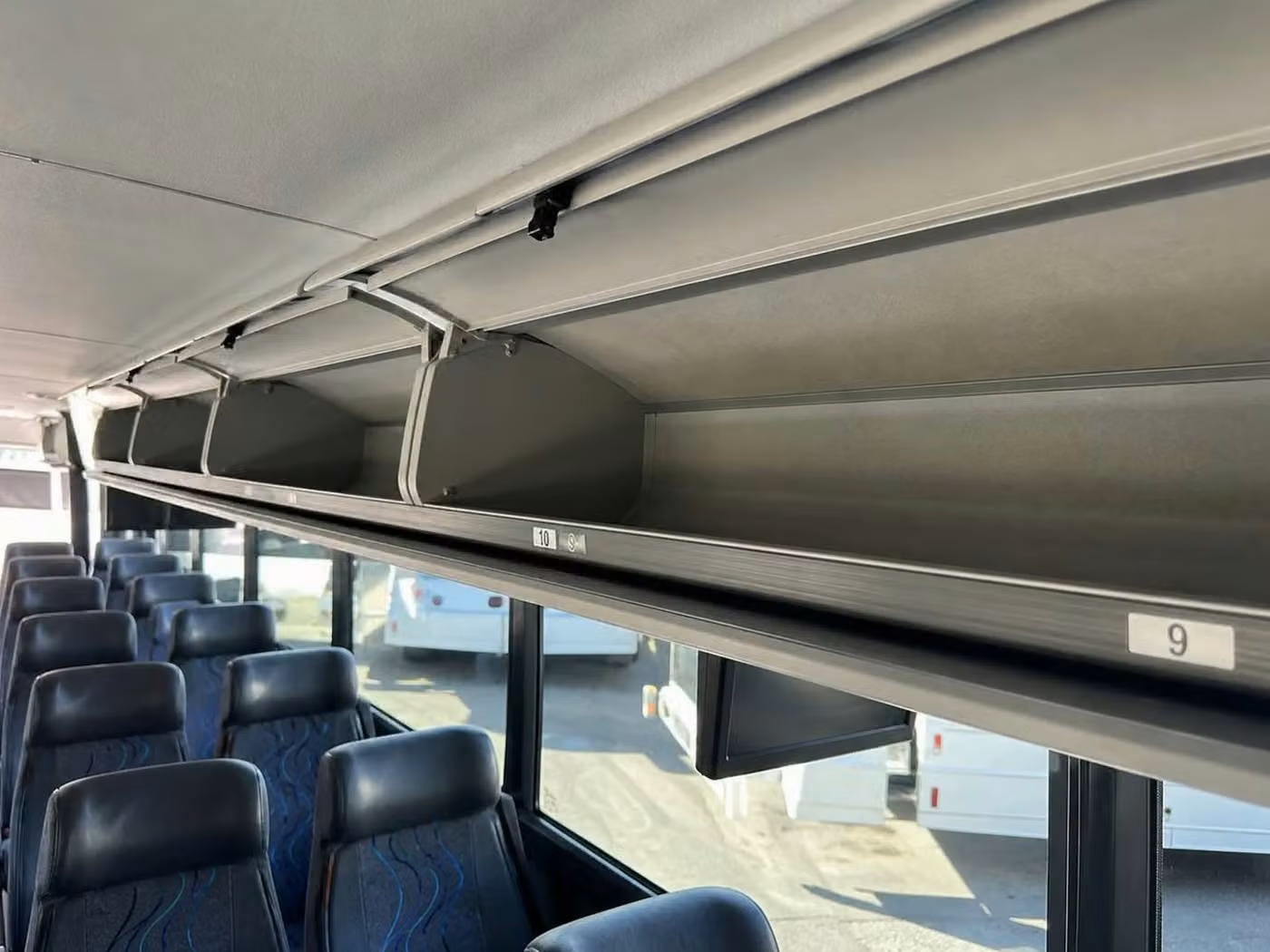 tucker 25 passenger minibus overhead storage