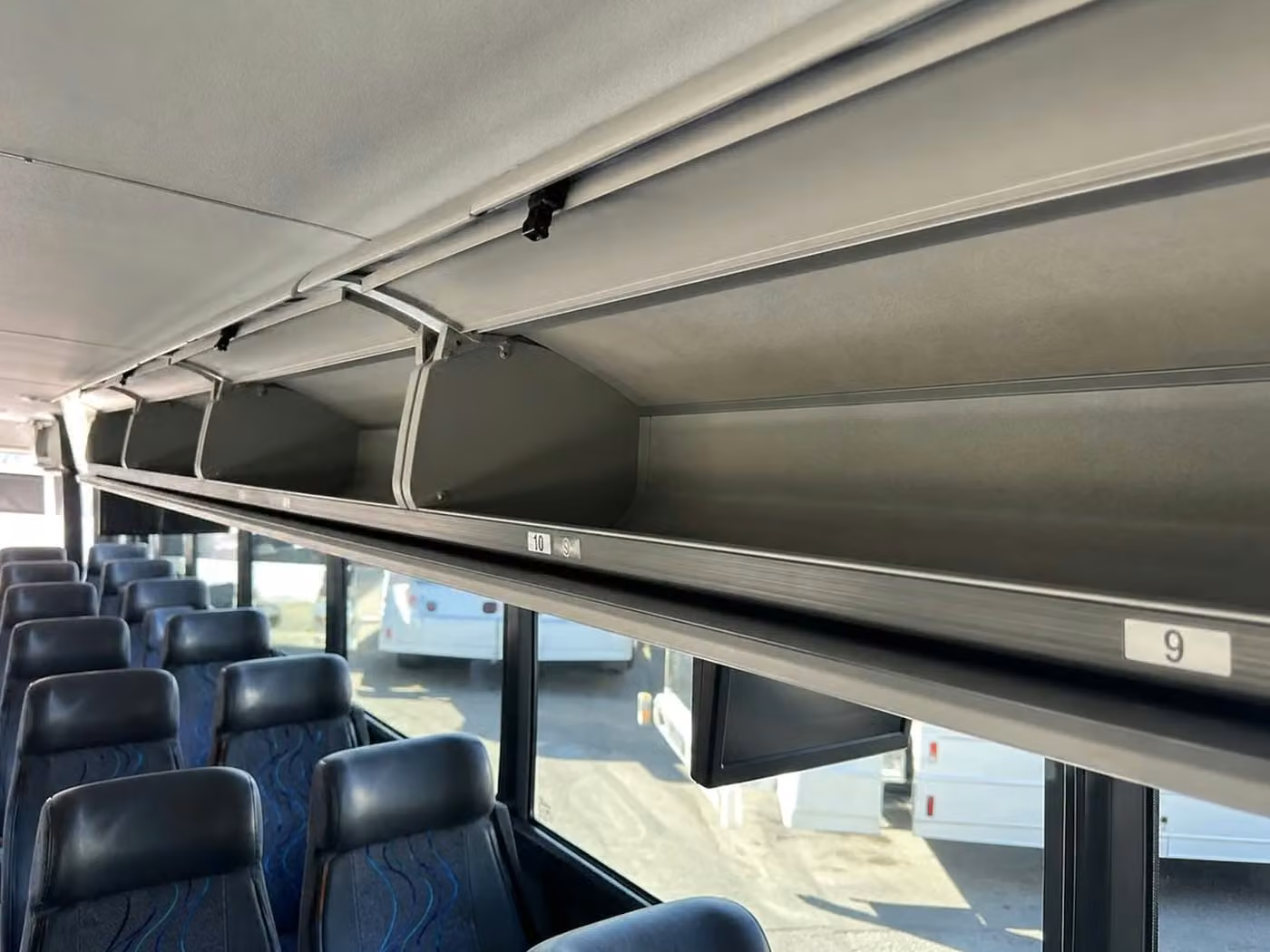 tucker 28 passenger minibus overhead storage
