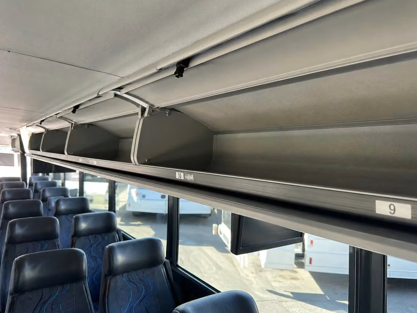 tucker 35 passenger minibus overhead storage
