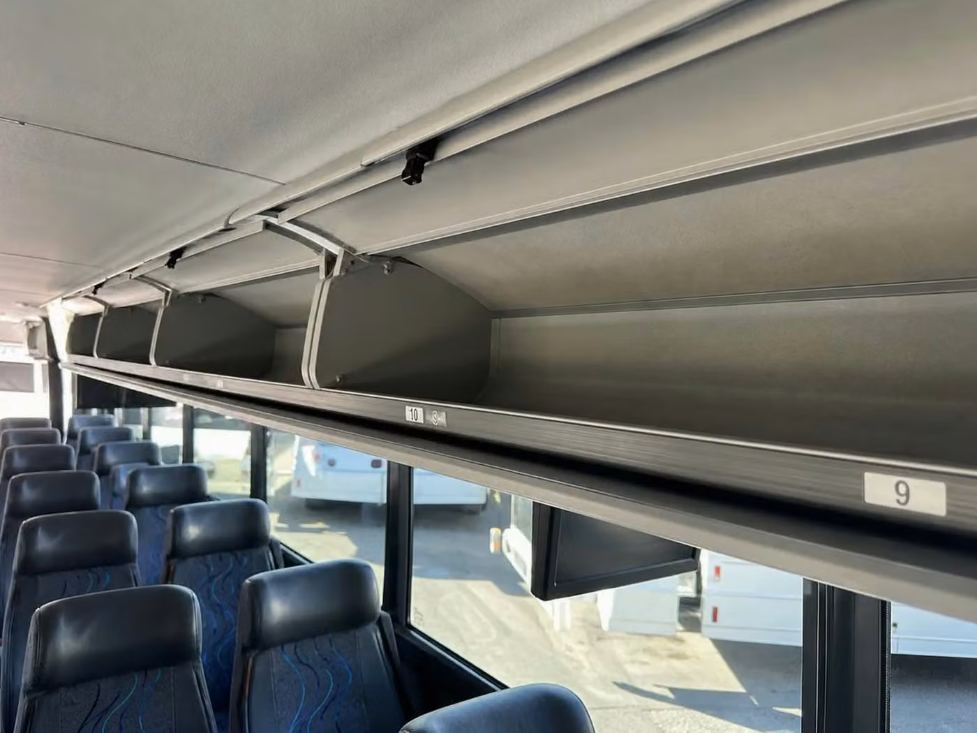 tucker 56 passenger charter bus overhead storage