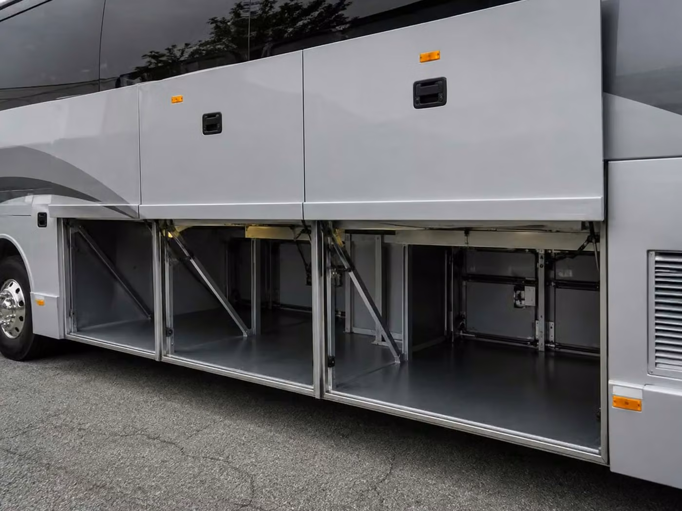 tucker charter bus under bus storage